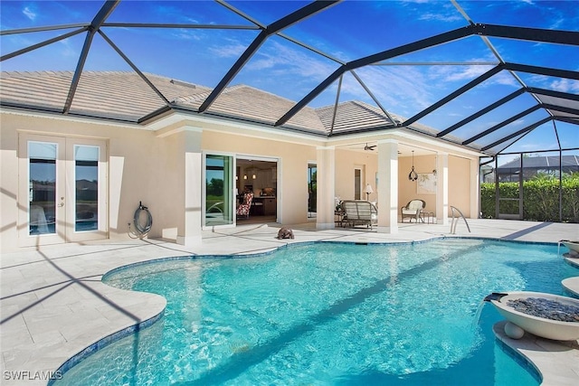 14364 Neptune Ave, Naples, FL 34114 - outdoor pool featuring a patio, french doors, and a lanai