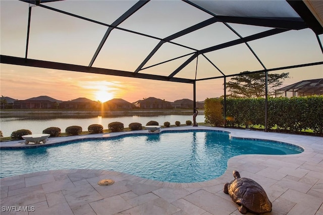 14364 Neptune Ave, Naples, FL 34114 - pool at dusk with an outdoor pool, a patio area, and a water view