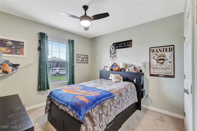 2701 NW Embers Ter, Cape Coral, FL 33993 - bedroom with light carpet, baseboards, and a ceiling fan