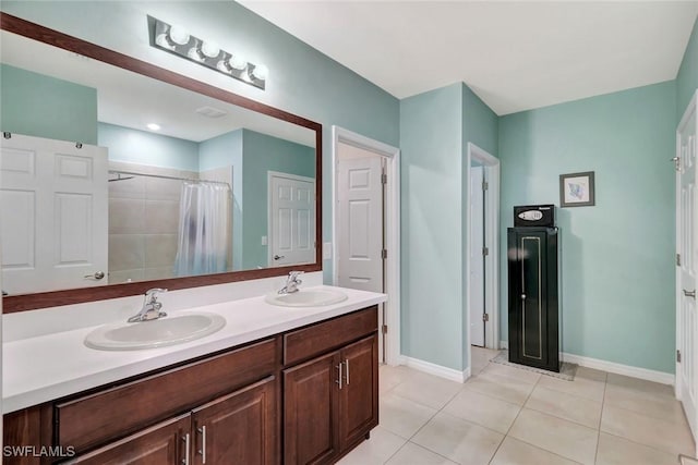 2701 NW Embers Ter, Cape Coral, FL 33993 - bathroom featuring double vanity, a sink, tile patterned floors, and a shower with curtain