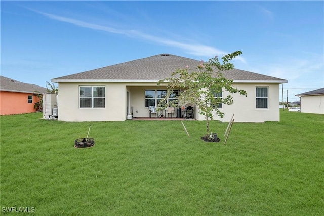 2701 NW Embers Ter, Cape Coral, FL 33993 - back of house with roof with shingles, stucco siding, and a yard