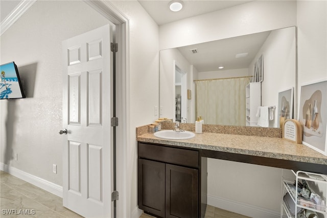 713 NE 31st Ter, Cape Coral, FL 33909 - full bathroom with baseboards, curtained shower, visible vents, and vanity