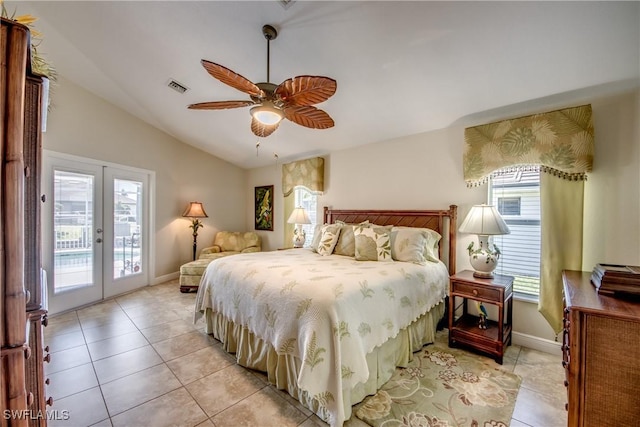 bedroom featuring access to exterior, vaulted ceiling, french doors, light tile patterned floors, and visible vents