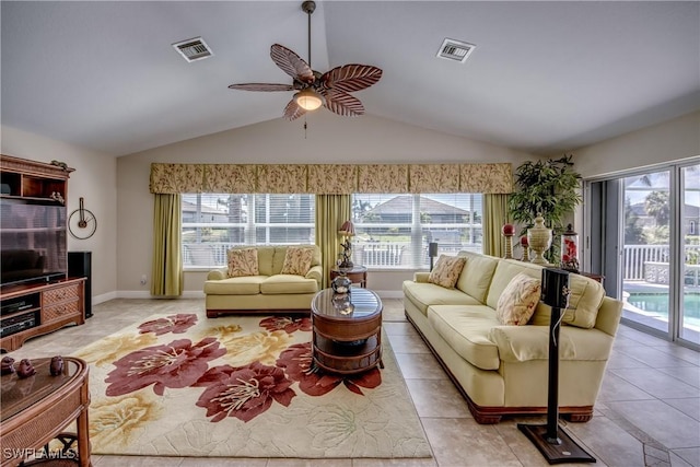 living room featuring light tile patterned floors, lofted ceiling, visible vents, and a ceiling fan