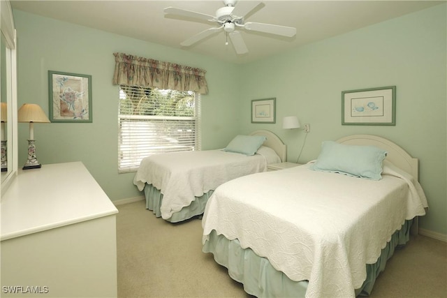 20700 Country Creek Dr Unit 823, Estero, FL 33928 - bedroom featuring baseboards, a ceiling fan, and light carpet