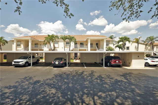 20700 Country Creek Dr Unit 823, Estero, FL 33928 - multi unit property featuring stucco siding, covered parking, and a residential view