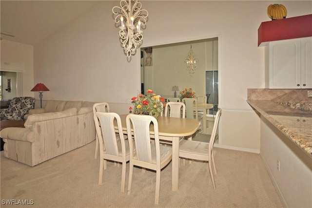 20700 Country Creek Dr Unit 823, Estero, FL 33928 - dining area with light colored carpet, lofted ceiling, and a chandelier