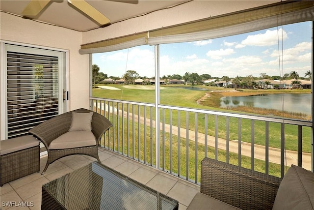 20700 Country Creek Dr Unit 823, Estero, FL 33928 - sunroom / solarium featuring ceiling fan, plenty of natural light, and a water view