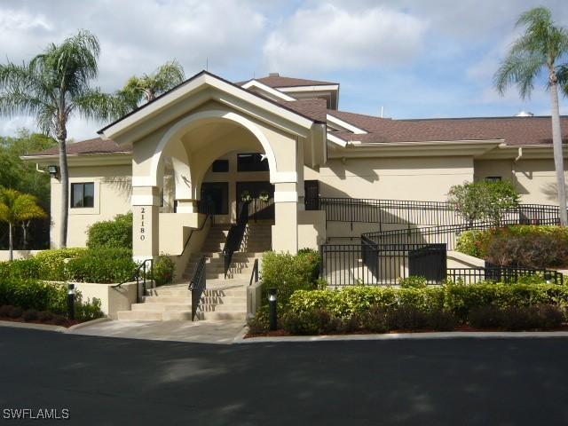 20700 Country Creek Dr Unit 823, Estero, FL 33928 - exterior space featuring fence and stairs