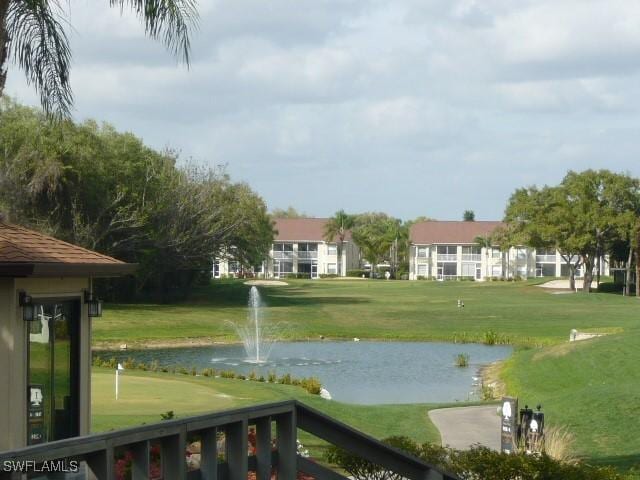 20700 Country Creek Dr Unit 823, Estero, FL 33928 - view of home's community with a yard and a water view