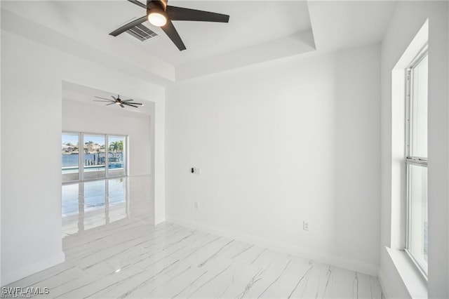 203 Old Burnt Store Rd S, Cape Coral, FL 33991 - spare room with marble finish floor, baseboards, and a ceiling fan