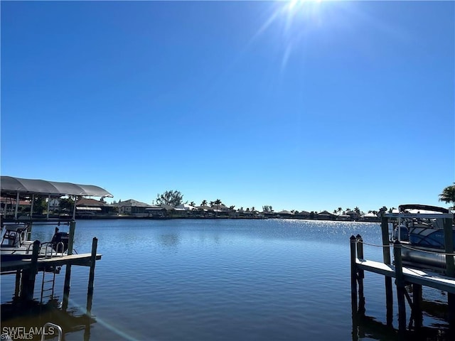 203 Old Burnt Store Rd S, Cape Coral, FL 33991 - dock area featuring a water view and boat lift