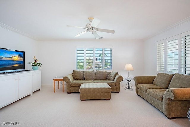 living area featuring light carpet, baseboards, crown molding, and ceiling fan