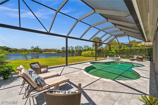 3911 Lakemont Dr, Bonita Springs, FL 34134 - view of pool featuring a water view, a pool with connected hot tub, a lanai, a patio, and a lawn