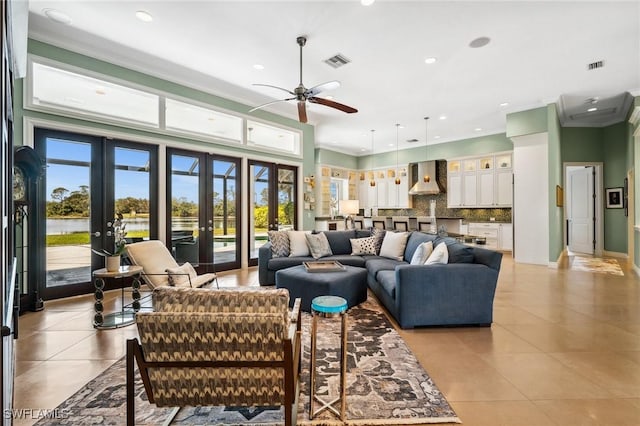 3911 Lakemont Dr, Bonita Springs, FL 34134 - living room with ceiling fan, visible vents, french doors, and light tile patterned floors