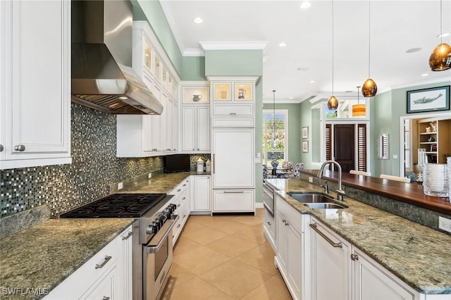 3911 Lakemont Dr, Bonita Springs, FL 34134 - kitchen featuring crown molding, a sink, light tile patterned flooring, high end appliances, and wall chimney exhaust hood