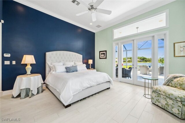 3911 Lakemont Dr, Bonita Springs, FL 34134 - bedroom featuring crown molding, french doors, an accent wall, access to exterior, and visible vents