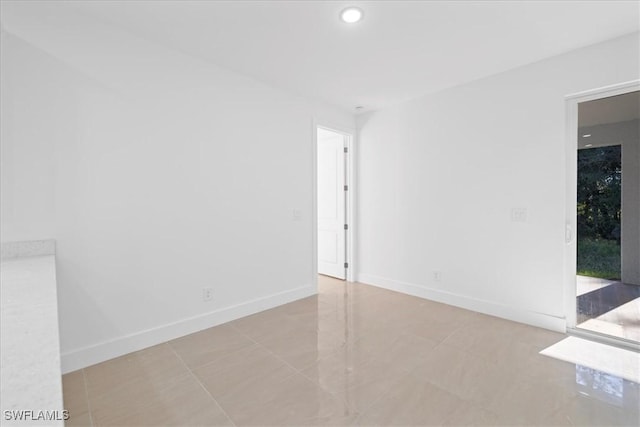150 Bell Blvd S, Lehigh Acres, FL 33974 - unfurnished room featuring baseboards and recessed lighting