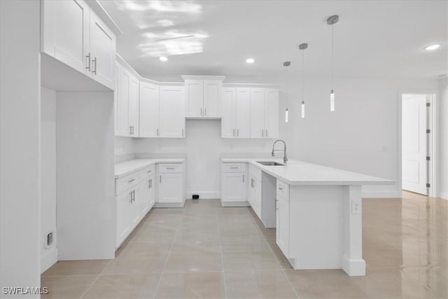 150 Bell Blvd S, Lehigh Acres, FL 33974 - kitchen featuring a sink, recessed lighting, a peninsula, and dishwasher