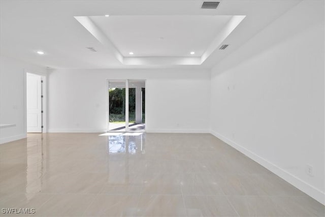 150 Bell Blvd S, Lehigh Acres, FL 33974 - spare room featuring baseboards, visible vents, recessed lighting, and a raised ceiling