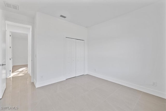 150 Bell Blvd S, Lehigh Acres, FL 33974 - unfurnished bedroom featuring baseboards and visible vents