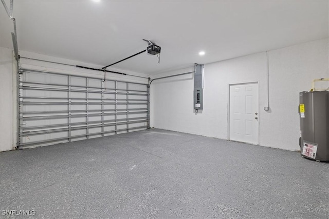 150 Bell Blvd S, Lehigh Acres, FL 33974 - garage with water heater and a garage door opener