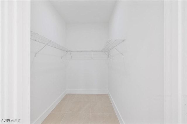 150 Bell Blvd S, Lehigh Acres, FL 33974 - spacious closet with light tile patterned flooring