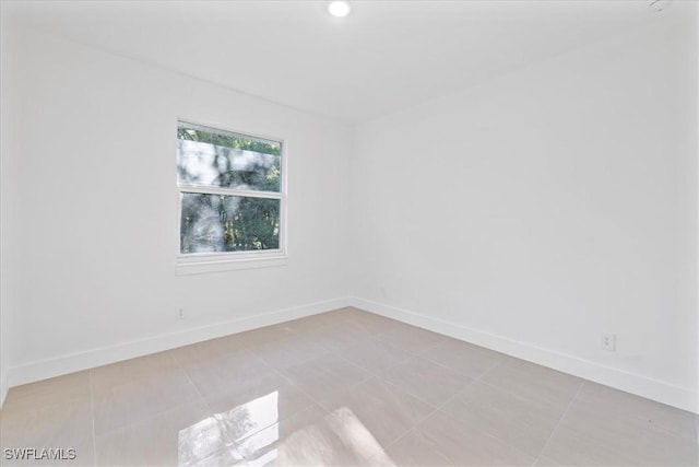 150 Bell Blvd S, Lehigh Acres, FL 33974 - unfurnished room with baseboards and light tile patterned floors