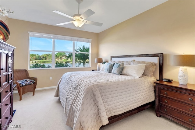 14561 Bellino Ter Unit 101, Bonita Springs, FL 34135 - bedroom featuring baseboards, a ceiling fan, and light carpet