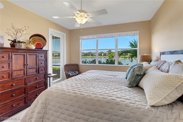 14561 Bellino Ter Unit 101, Bonita Springs, FL 34135 - bedroom featuring a ceiling fan, a water view, and multiple windows