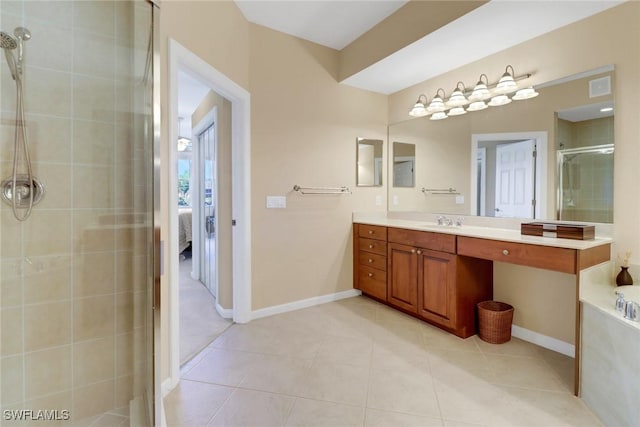 14561 Bellino Ter Unit 101, Bonita Springs, FL 34135 - full bathroom featuring tile patterned flooring, vanity, baseboards, a stall shower, and a garden tub