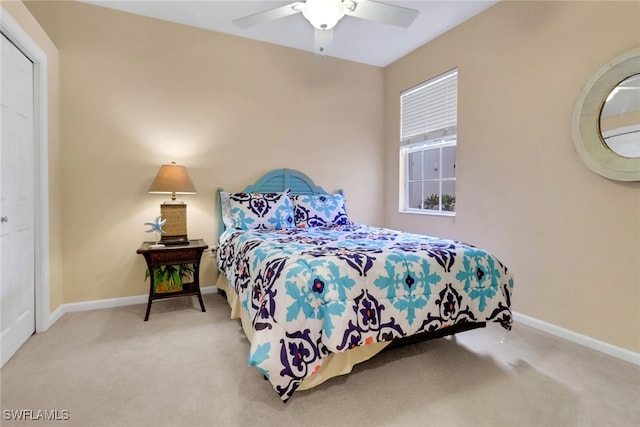 14561 Bellino Ter Unit 101, Bonita Springs, FL 34135 - bedroom featuring baseboards, ceiling fan, and carpet