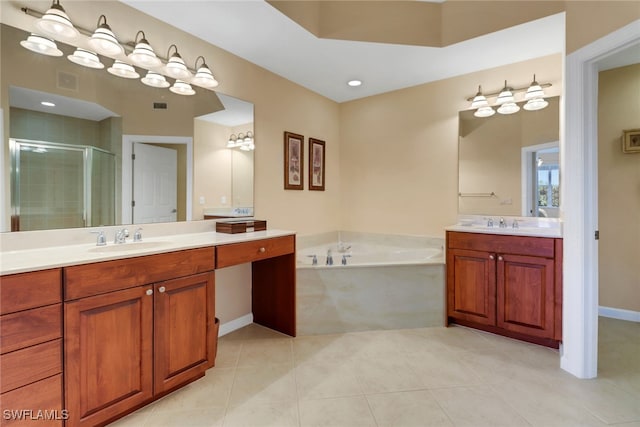 14561 Bellino Ter Unit 101, Bonita Springs, FL 34135 - bathroom with a sink, two vanities, a shower stall, a garden tub, and tile patterned flooring