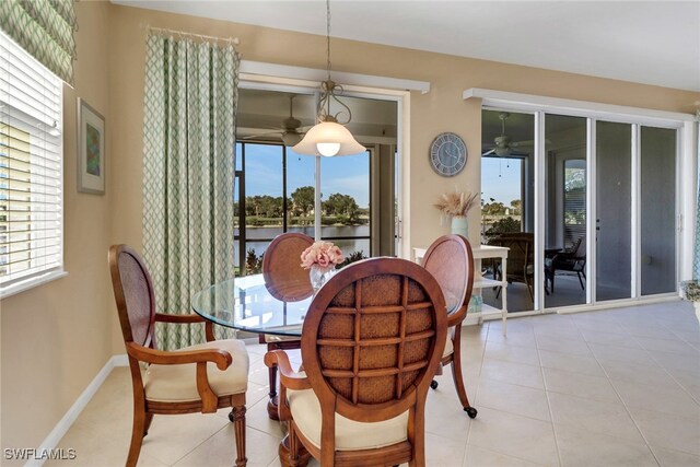 14561 Bellino Ter Unit 101, Bonita Springs, FL 34135 - dining room with baseboards, light tile patterned floors, and a ceiling fan