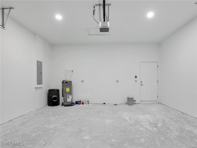 633 Cane St E, Lehigh Acres, FL 33974 - garage featuring water heater, electric panel, a garage door opener, and recessed lighting