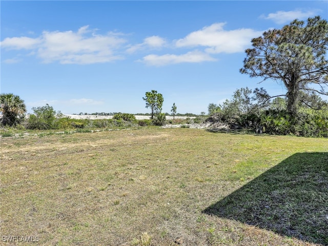 633 Cane St E, Lehigh Acres, FL 33974 - view of grassy yard with a view of countryside