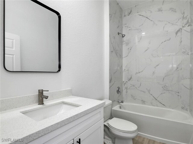 633 Cane St E, Lehigh Acres, FL 33974 - full bathroom with vanity, toilet, shower / tub combination, and wood finished floors