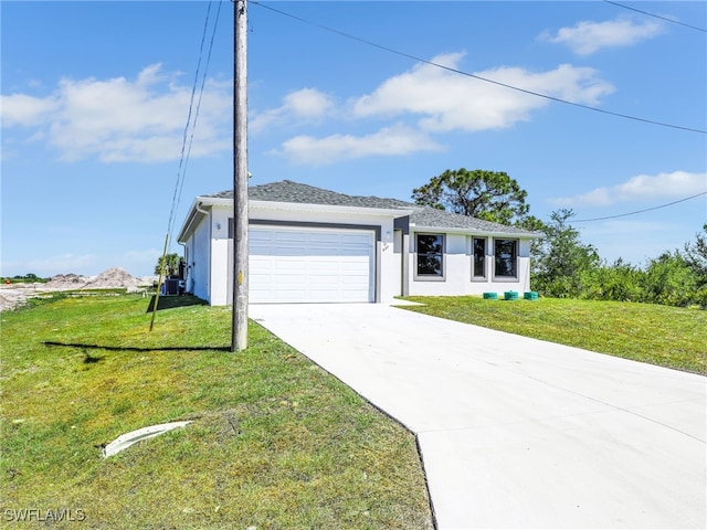633 Cane St E, Lehigh Acres, FL 33974 - view of front of property featuring an attached garage, driveway, a front lawn, and stucco siding