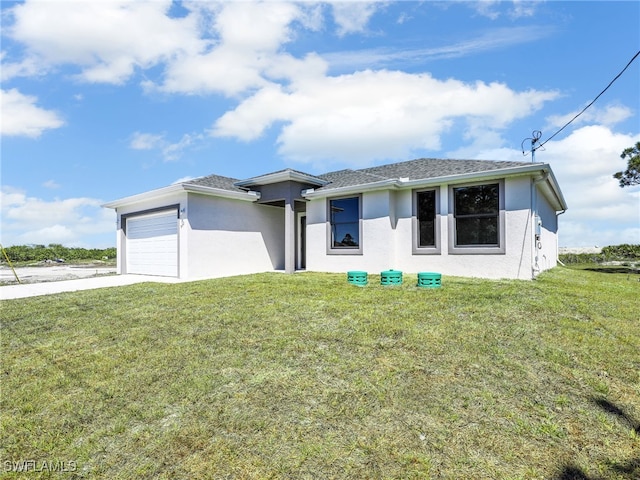 633 Cane St E, Lehigh Acres, FL 33974 - view of front of house with stucco siding, a garage, and a front yard