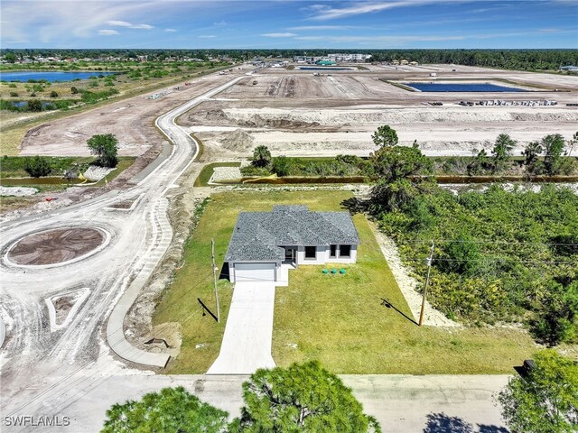 633 Cane St E, Lehigh Acres, FL 33974 - aerial view of property and surrounding area with a large body of water