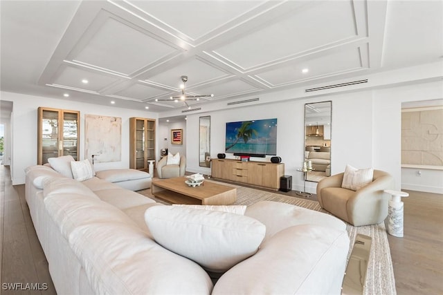 living area featuring light wood-style flooring, recessed lighting, coffered ceiling, and baseboards