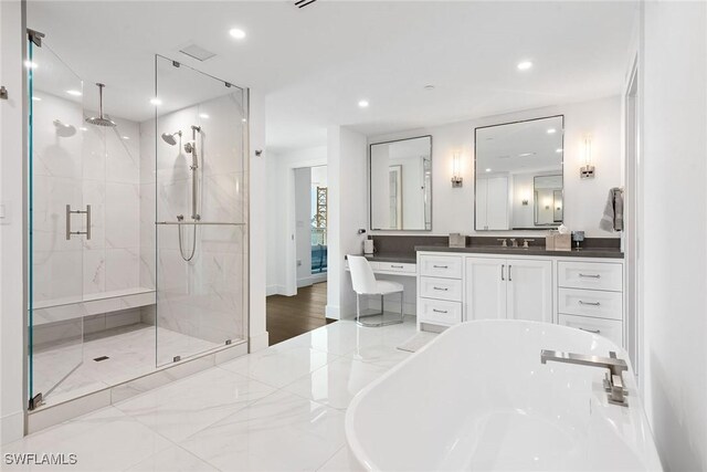 13945 Old Coast Rd Unit 406, Naples, FL 34110 - bathroom featuring a shower stall, a soaking tub, recessed lighting, and vanity