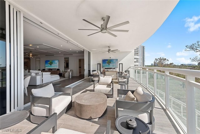 balcony featuring an outdoor living space and a ceiling fan
