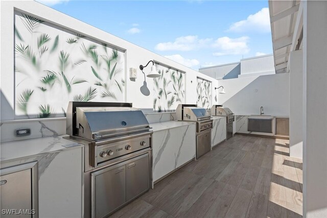 13945 Old Coast Rd Unit 406, Naples, FL 34110 - view of patio / terrace with a grill, area for grilling, and a sink