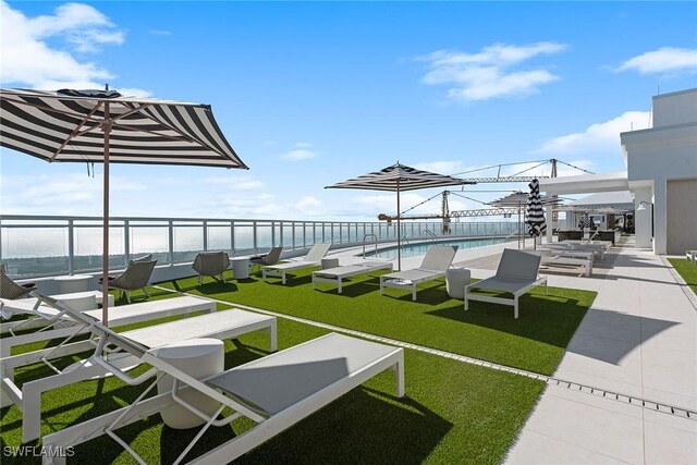 13945 Old Coast Rd Unit 406, Naples, FL 34110 - view of green lawn with a water view
