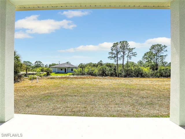 1134 Cumming St E, Lehigh Acres, FL 33974 - view of yard with a patio