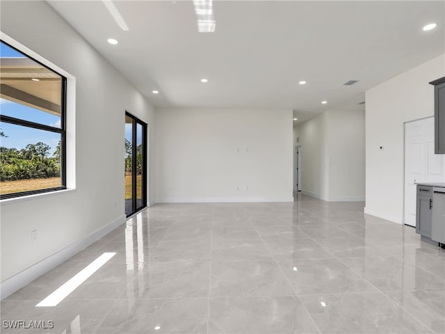 1134 Cumming St E, Lehigh Acres, FL 33974 - empty room with recessed lighting and baseboards