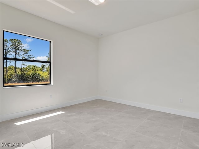 1134 Cumming St E, Lehigh Acres, FL 33974 - empty room featuring baseboards