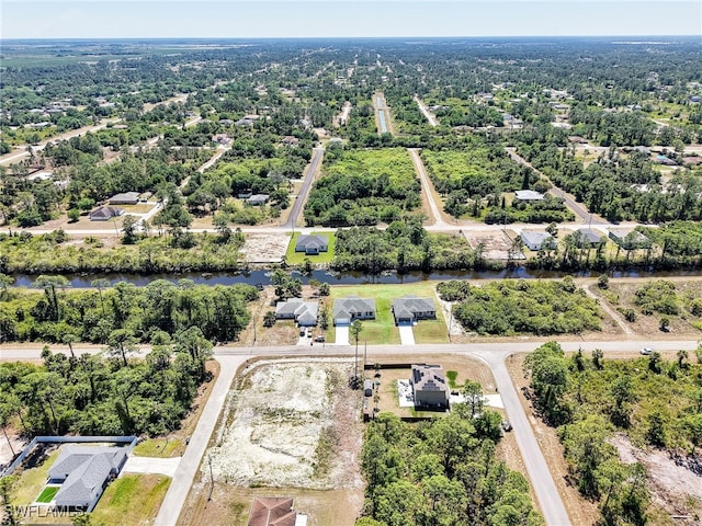 1134 Cumming St E, Lehigh Acres, FL 33974 - aerial perspective of suburban area featuring a nearby body of water