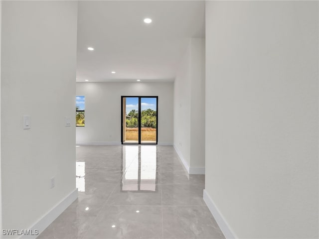 1134 Cumming St E, Lehigh Acres, FL 33974 - spare room featuring baseboards, recessed lighting, and light marble finish flooring